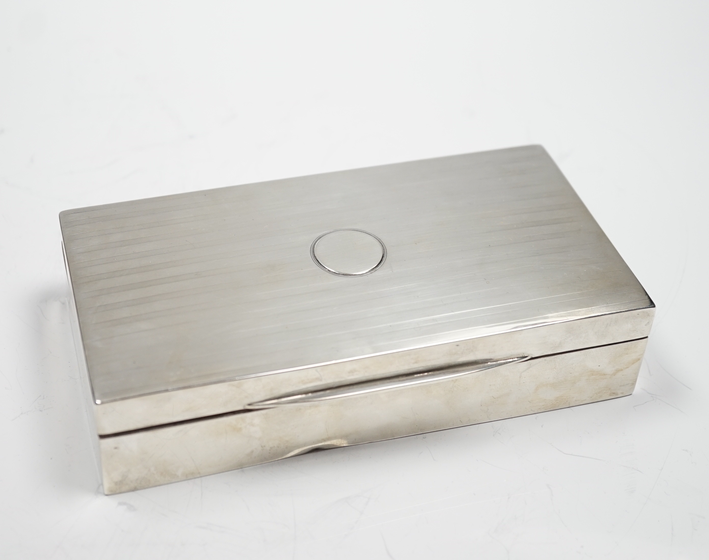 A George V silver mounted rectangular cigarette box, Birmingham, 1918, 17.2cm.